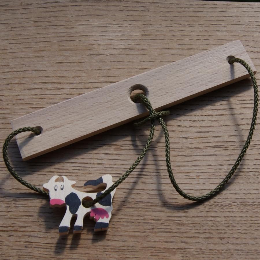 The cow, headache wood and string handcrafted