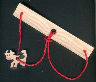 The cow, headache wood and string handcrafted