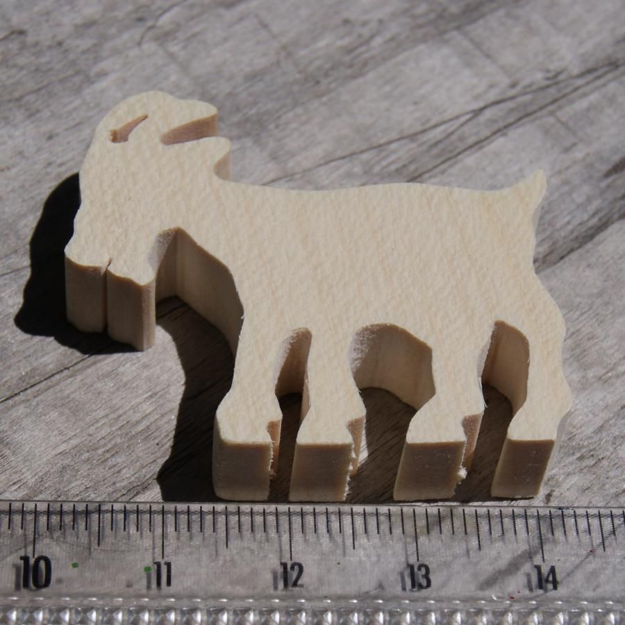 Miniature wooden goat figurine to decorate