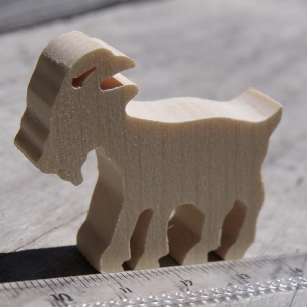 Miniature wooden goat figurine to decorate
