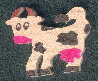 Miniature wooden cow figurine to decorate