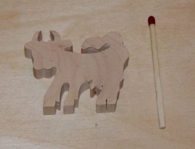 Miniature wooden cow figurine to decorate