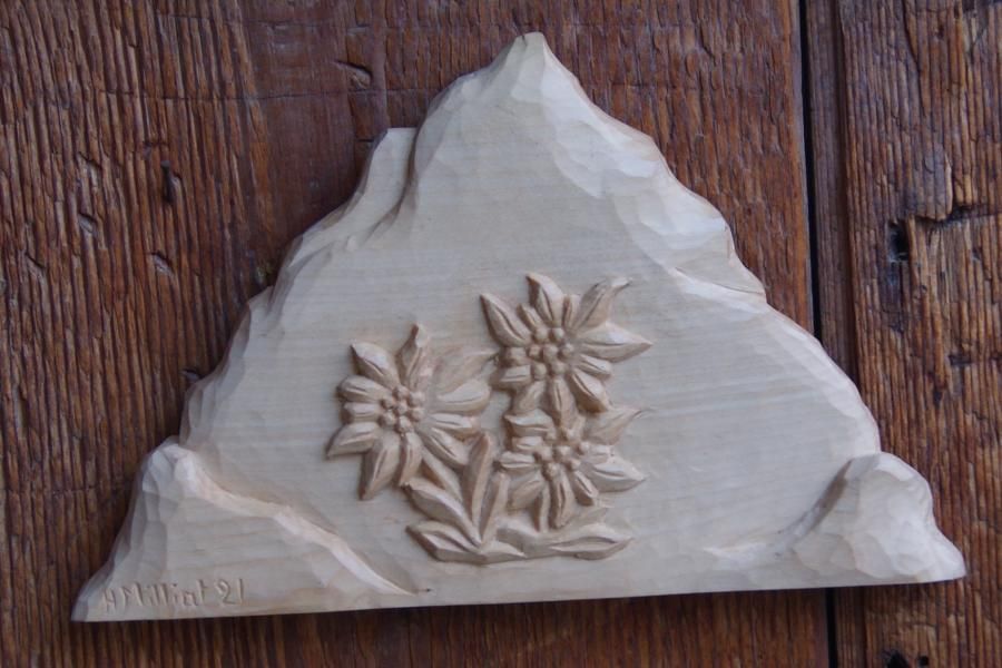 Mountain with hand carved edelweiss