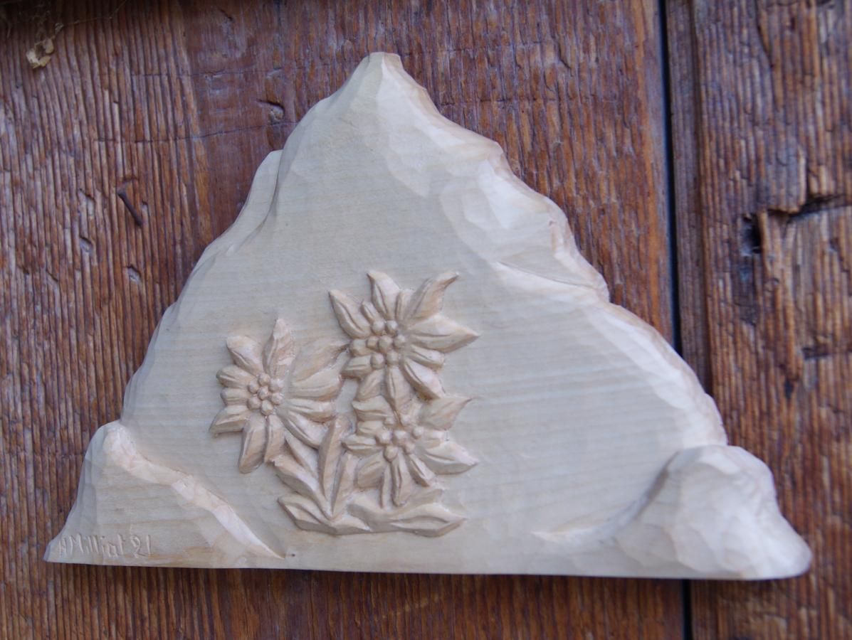 Mountain with hand carved edelweiss