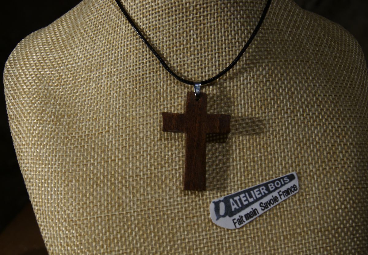 small cross pendant made of solid walnut wood