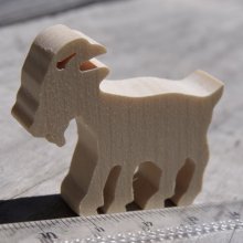 Miniature wooden goat figurine to decorate