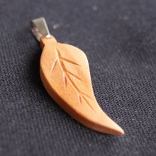 pendant leaf waxed cherry wood, handmade jewel with ribs